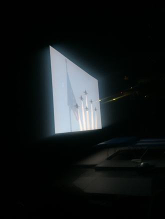This video screen presents a picture of the American Flag and airplanes from the Air Force. The video played after the National Anthem at the end of the show. (The Broadcaster/ Tori Moss)
