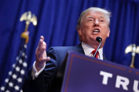 In this June 16, 2015 file photo, Donald Trump announces that he will seek the Republican nomination for president, in the lobby of Trump Tower in New York. Trump vows to bring back the millions of American jobs lost to China and other foreign competitors if voters put him in the White House. Economists say he wouldn’t stand a chance: Trump’s boundless self-confidence is no match for the global economic forces that took those jobs away. (AP Photo/Richard Drew, File)