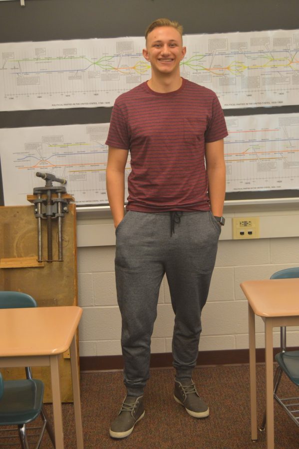 Noah Spochart, senior, wore a classy but comfortable fall outfit for school. With grey and black joggers, a red and black striped shirt, and grey sneakers, his fall outfit is complete.