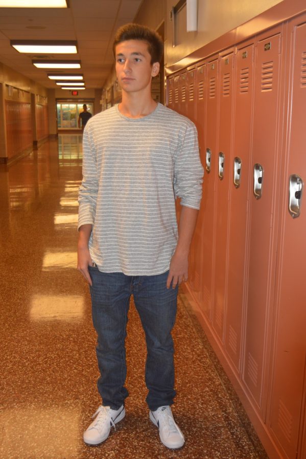 Ethan Buck, sophomore, wears a causal long sleeve shirt and jeans to school. To go with the pants and long sleeve, Buck wore white and black sneakers. (Elaina Joyner/ Broadcaster)
