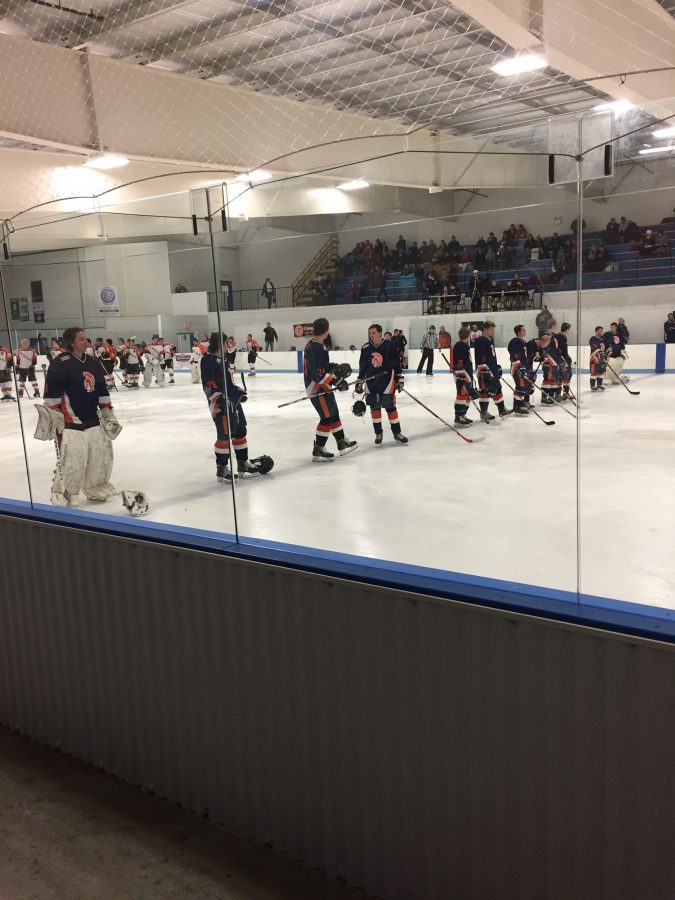 Hershey Trojans stand on the line during the National Anthem before puck drop. The Trojans beat the Palmyra Cougars 4-2 on Friday November 4, 2016 at Klick Lewis Arena. (Broadcaster/
Kieran Holley)
