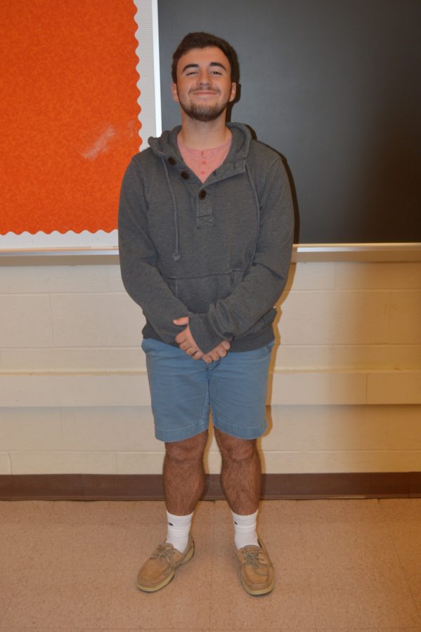 Adam Paymer, sophomore, makes a fashion statement with his blue shorts along with his Sperrys, sweater, and salmon colored shirt. (Elaina Joyner/ Broadcaster)