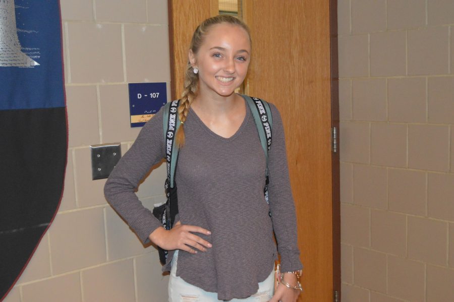 Freshmen Alexa Blankenbiller wears her grey sweater and light wash ripped jeans while sporting her Pink brand backpack and “Alex and Ani” bracelets. (Elaina Joyner/ Broadcaster)