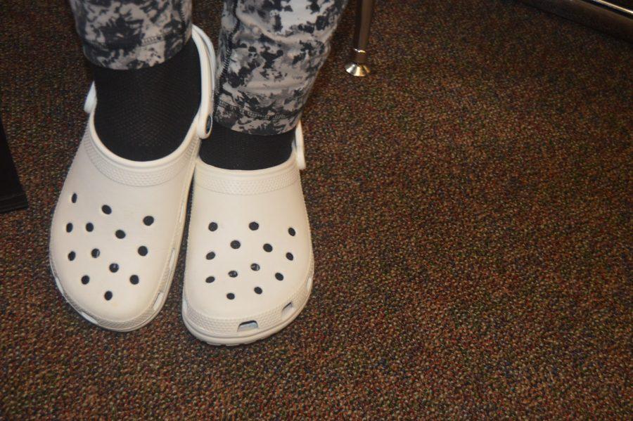 The waterproof and durable white Crocs, worn by sophomore Diana Lloyd, are perfect for fall, with or without socks. (Elaina Joyner/ Broadcaster)