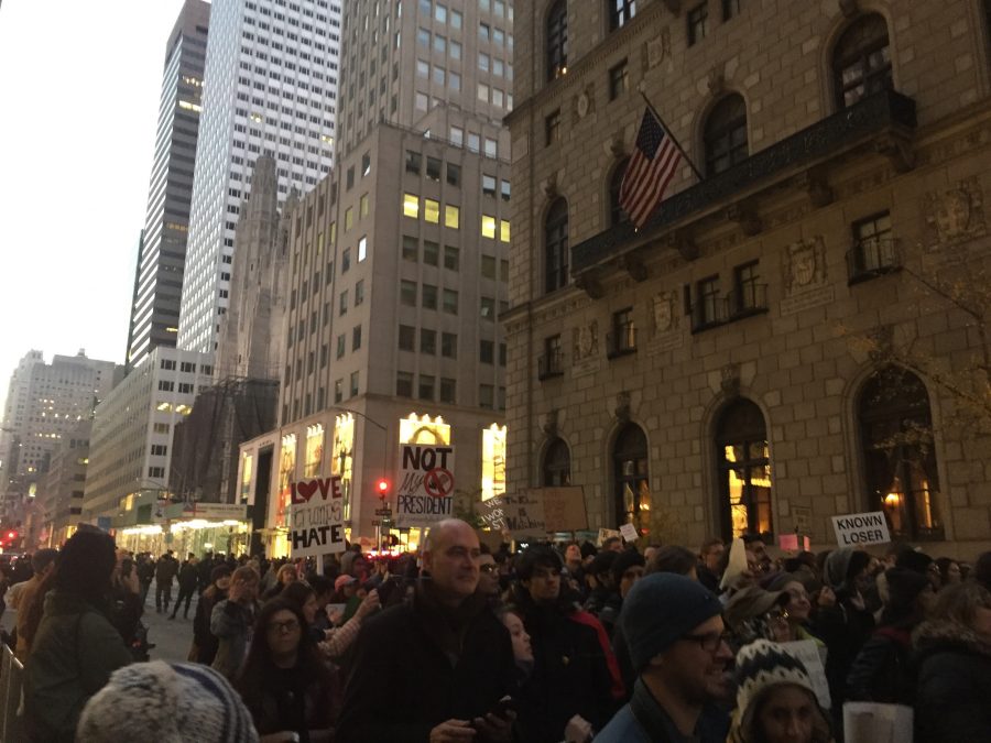 Protesters flood streets on Saturday evening. Many held signs talking about Trump’s 
wrongdoings. (Broadcaster/Kaitlin Christ)


