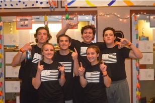 (Top L-R, Marc Zuckerman, Scott Eberle, Devin Bratton, and Zach Shrift; Bottom L-R, Natalie Sicker and Ali Cronin) Team U.S.A. poses after win against Two Bump Chumps in 6th Annual Holiday Volleyball Tournament. The final score of the game was 17-15. They will be moving on to the Final Four. (The Broadcaster, Kate Sinz)