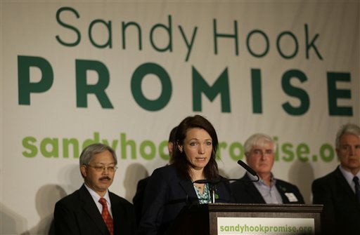 Nicole Hockley, center, speaks in front of San Francisco Mayor Ed Lee, rear from left, Ron Conway of SV Angel, and San Francisco District Attorney George Gascon at a Sandy Hook Promise news conference in San Francisco, Thursday, March 14, 2013. Families of children killed in the Sandy Hook Elementary School shooting on Dec.14, 2012, in Newton, Conn., joined San Francisco Bay Area families of shooting victims and technology and political leaders to announce the Sandy Hook Promise Innovation Initiative, an initiative to prevent future gun violence. Hockleys son Dylan was killed in the Sandy Hook Elementary School shooting. (AP Photo/Jeff Chiu)