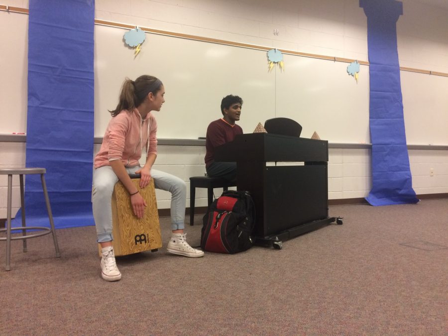 Junior Audrey Stinson (left) and Matthew Abraham (right) duet in the song “Car Radio” by twentyone pilots on Nexus Open Mic Night in the HHS LGI. Both have been very interested in music, with Stinson playing the drums and Abraham singing, playing the piano, and more. (Broadcaster/Jenny Kim)