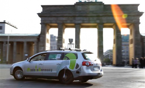 In this Saturday, Sept. 17, 2011 photo a car of the Autonomos Labs maneuvers controlled by a computer through Berlin, Germany. The car is driven by a computer that steers, starts and stops itself. A 360 degrees laser scanner on top of the car, a GPS system and other sensors monitor the surrounding traffic. A driver sits only for security reasons behind the steering wheel. The Autonomos team is part of the ArtificialIntelligence Group of the Free University Berlin. (AP Photo/Michael Sohn)