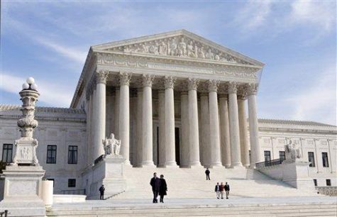 On Jan. 25, 2012, people stand outside of the Supreme Court building in Washington, D.C. During his presidency, Trump will appoint a new Supreme Court justice to fill the spot of the late Anthony Scalia.  (AP Photo/J. Scott Applewhite)