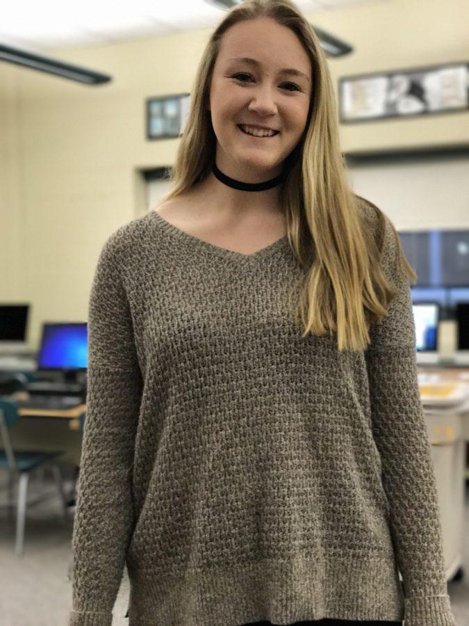 Emily Liesch, Sophomore at HHS, wore a black choker to school. She is wearing the choker with a tan v-neck sweater. (The Broadcaster/ Sofia Suri)