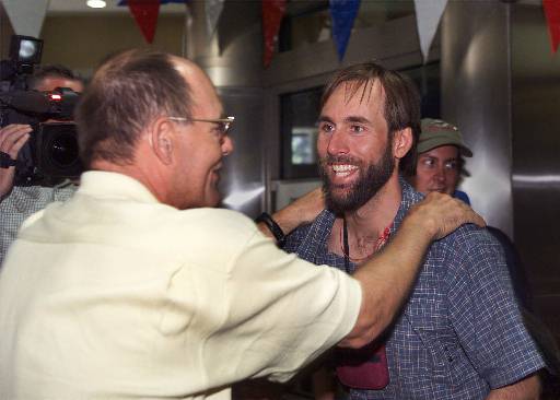 Climber Erik Weihenmayer, right, greets his father, Ed Weihenmayer, as he arrives at Los Angeles International airport on Wednesday, June 6, 2001, after returning from a trip in which he became the first blind man to summit Mt. Everest on May 25, 2001. (AP Photo/Jill Connelly)