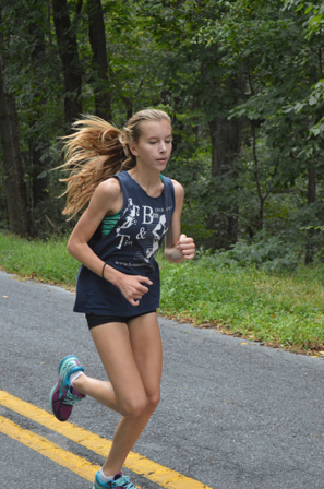 Faith Mark, sophomore, prepares for an upcoming meet early in the cross country season. Mark ran at Peffley Hills to build endurance and stronger leg muscles for the season ahead. (Broadcaster/Robert Sterner)
