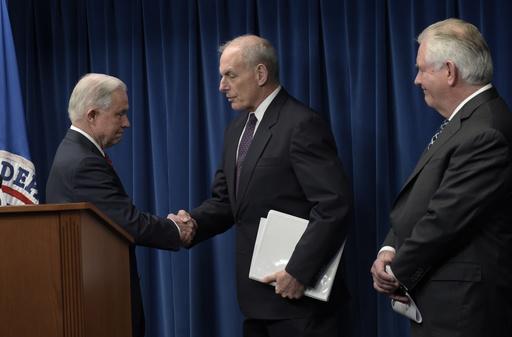 Homeland Security Secretary John Kelly, center, shakes hands with Attorney General Jeff Sessions, left, as Secretary of State Rex Tillerson watches at right, as they take turns making statements on issues related to visas and travel, Monday, March 6, 2017, at the U.S. Customs and Border Protection office in Washington. (AP Photo/Susan Walsh)