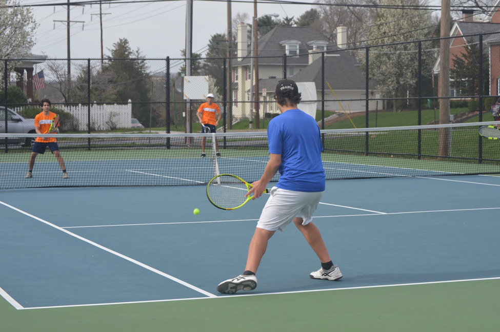 On Monday, April 10 Druv Tripathi (left) and Shengdi You (right) play doubles for HHS against Lower Dauphin. The HHS double pair won the match including a 6-4 final set. (Broadcaster/ Emily Tubbs)