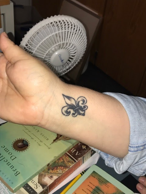 HHS English teacher Michelle O’brien shows off her first tattoo on March 20, 2017. O’Brien waited until she turned 50 to get the tattoo. (Broadcaster/Emerson Freer) 