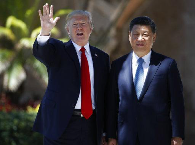  In this Friday, April 7, 2017 file photo, President Donald Trump and Chinese President Xi Jinping pause for photographs at Mar-a-Lago in Palm Beach, Fla. when Trump was meeting again with Xi with U.S. missile strikes on Syria adding weight to his threat to act unilaterally against the nuclear weapons program of Chinas ally, North Korea. North Korea has vowed to bolster its defenses to protect itself against airstrikes like the ones Trump ordered against an air base in Syria. The North called the airstrikes absolutely unpardonable and said it proves that its nuclear weapons are justified to protect the country against Washingtons evermore reckless moves for a war. (AP Photo/Alex Brandon, File)

