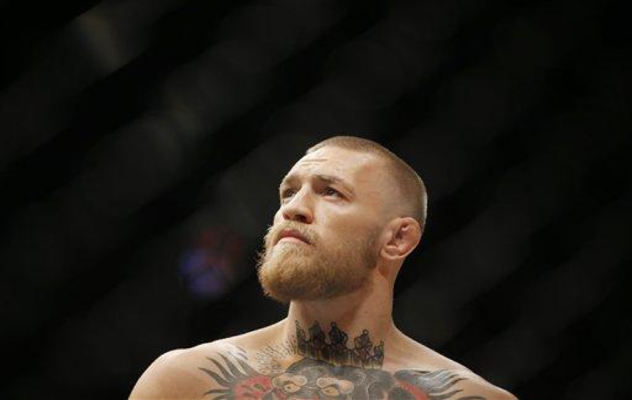 Conor McGregor fights Nate Diaz during their welterweight mixed martial arts bout at UFC 202 on Saturday, Aug. 20, 2016, in Las Vegas. McGregor won by split decision. (AP Photo/Isaac Brekken)
