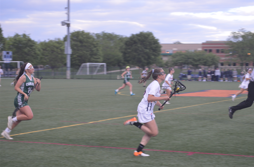 Hershey High School freshman Maddie Zimmer, right, has a breakaway before scoring her first goal of the game. Hershey beat Carlisle 14-6 on Tuesday May 2, 2017 at Hershey’s home field.(Broadcaster/ Lexie Corcoran)