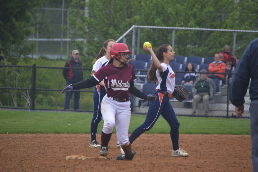 Claire Sheppard, freshman, throws the ball back to the pitcher after a Mechanicsburg hit. (Broadcaster/Moxie Thompson)