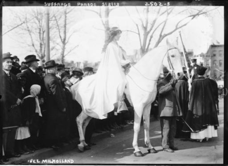 In this photo provided by the Library of Congress, taken in 1913, attorney Inez Milholland Boissevain rides astride suffrage parade in Washington as the first of four mounted heralds. Thousands of women take to the streets of Washington, demanding a greater voice for women in American political life as a new president takes power. This will happen on Saturday, Jan. 21, 2017, one day after the inauguration of Donald Trump. This DID happen more than 100 years ago, one day before the inauguration of Woodrow Wilson. (Library of Congress via AP)