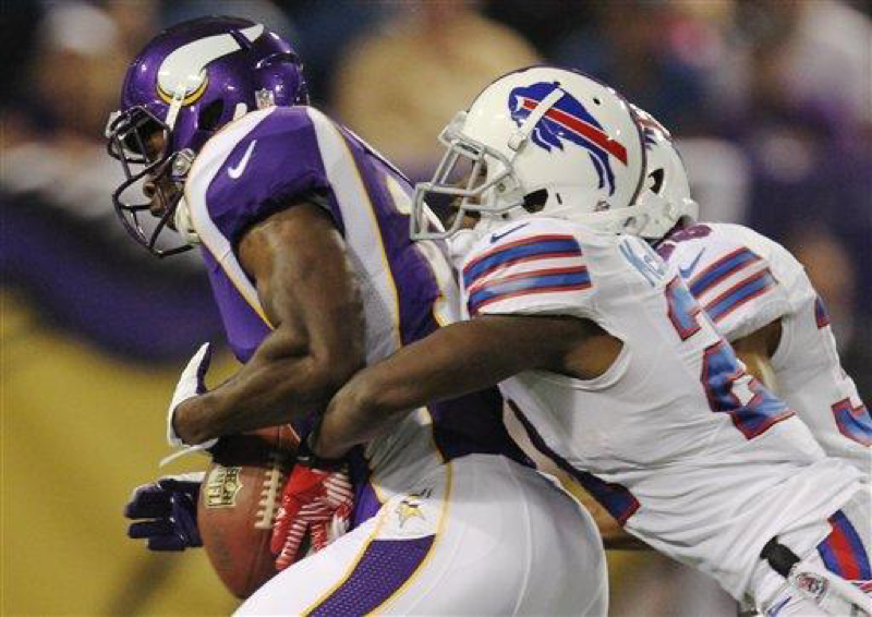 Minnesota Vikings wide receiver Stephen Burton (11), left, gets stripped of the ball by Buffalo Bills defensive back Leodis McKelvin (21), right, in the first half of an NFL preseason football game, Friday, Aug. 17, 2012, in Minneapolis. (AP Photo/Genevieve Ross)