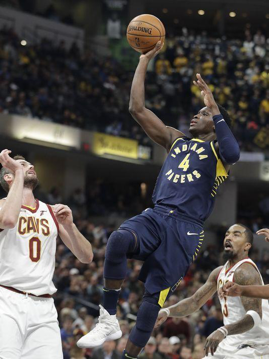 Pacers’ Victor Oladipo shoots on Kevin Love in the second half of the close game on Friday, December 8th. Oladipo made an impressive contribution to the game with 33 points, eight rebounds, and five assists.
