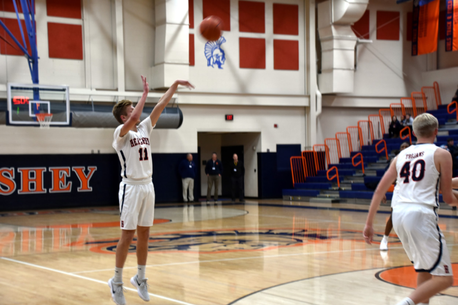 HHS senior Jake Wilson shoots the ball scoring for Hershey against their longtime rival, the Palmyra Cougars. Wilson scored a total of 6 points Friday night helping win the game with a final score of 60-35. (Broadcaster/Katherine Clark)