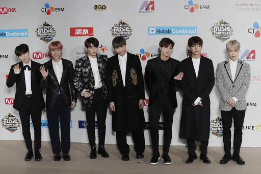 Members of South Korean K-Pop music band BTS pose for photos on the red carpet of the 2016 Mnet Asian Music Awards (MAMA) in Hong Kong, Friday, Dec. 2, 2016.  Along with their other achievements, they won six awards for the Mnet Asian Music Awards from 2015-2017. (AP Photo/Kin Cheung)
