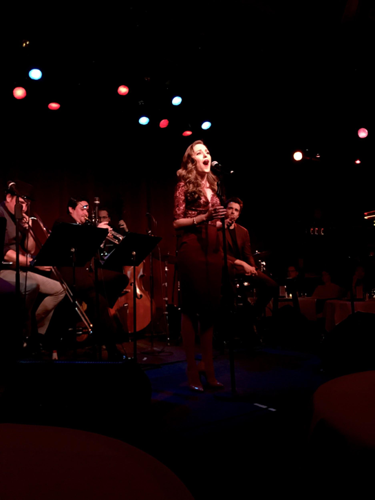 Laura Osnes, also known as Julia Trojan, sings her heart out with the other members of The Donny Nova Band on stage at Birdland Jazz Club on March 11, 2018. The show opened on April 26, 2017, and closed on September 17, 2017, since, being performed at Birdland Jazz Club in New York City multiple times. (The Broadcaster/Tori Moss)
