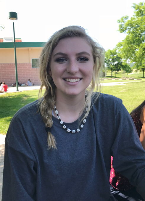 Sophomore Annie Shay poses for a photo outside the cafeteria at HHS.  Shay is working at Old Navy for the first time this summer, and said she plans on spending her salary on items like the French Club trip to France, concert tickets, and clothing. (Broadcaster/Olivia Bratton)