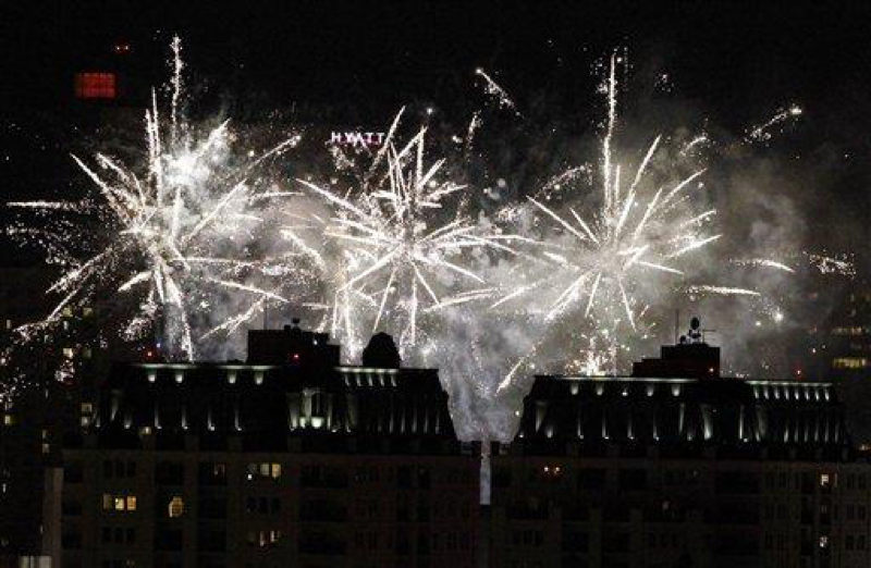 Fireworks explode over the skyline of downtown Denver during the third-annual Independence Eve at the City and County Building at Civic Center Park show on Tuesday, July 3, 2012. (AP Photo/David Zalubowski)