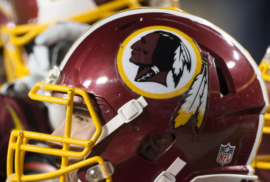 Washington Redskins helmet is worn by team quarterback, Kevin Hogan. Showing off the Redskins logo, team owner Daniel Snyder went to the Supreme Court on June 19, 2017, for complaints about the racist logo and name. (Keith Allison /CC BY-SA 2.0)