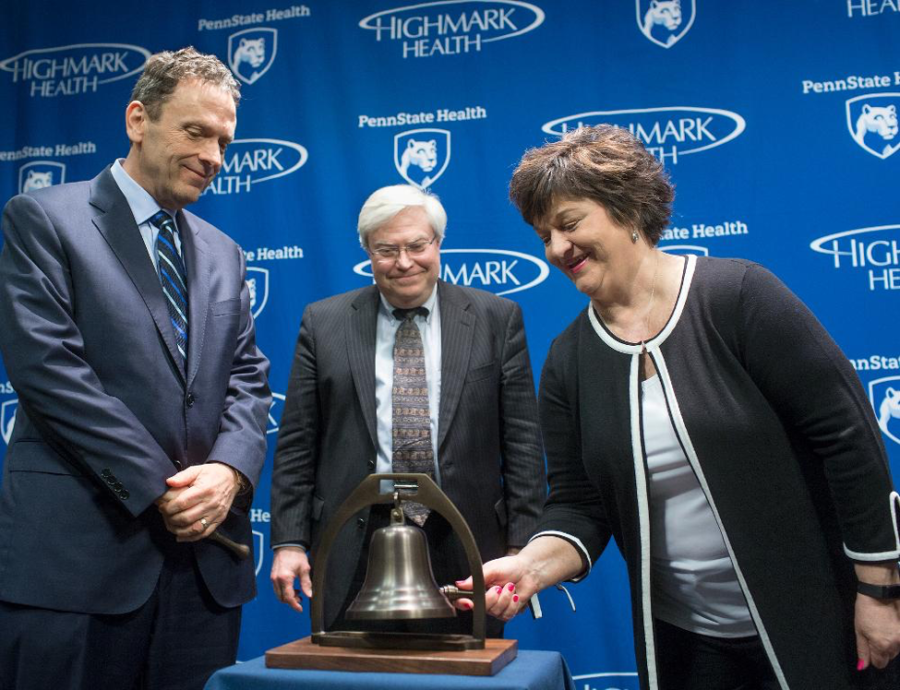 A patient of the Penn State Cancer Institute, Rosemary Manbachi, is shown ringing a bell, which signifies the end of her treatment for the disease on Thursday, April 5, 2017. On that Thursday the announcement of the research grant of 25 million dollars was made. (Penn State Milton S. Hershey Medical Center)