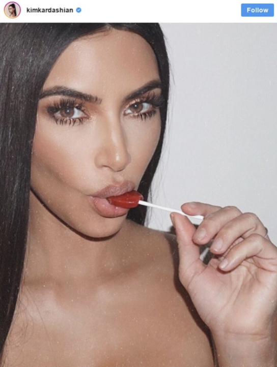 In an Instagram post that has since been deleted, Kim Kardashian, pictured with the lollipop, captioned the picture, “You guys… @flattummyco just dropped a new product. They’re Appetite Suppressant Lollipops and they’re literally unreal. They’re giving the first 500 people on their website 15% OFF so if you want to get your hands on some… you need to do it quick!” (Kim Kardashian)
