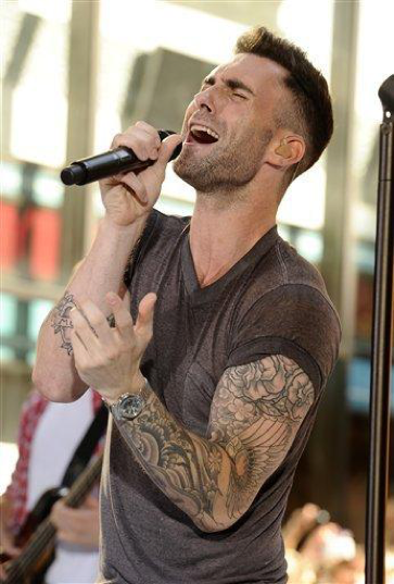 In this image released by NBC, singer Adam Levine, of the group Maroon 5, performs on the Today show in New York on Friday, Aug. 5, 2011. (AP Photo/NBC, Peter Kramer)