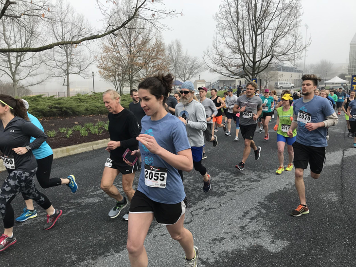 Emma Melhorn, racer 2055 and an English teacher at Hershey Middle School, runs with the other participants as they begin the race on Saturday, April 28th, 2018 at Henry Hershey Field. The Race 4 Linda had a great attendance of loyal participants. (Broadcaster/Laurel Fleszar)