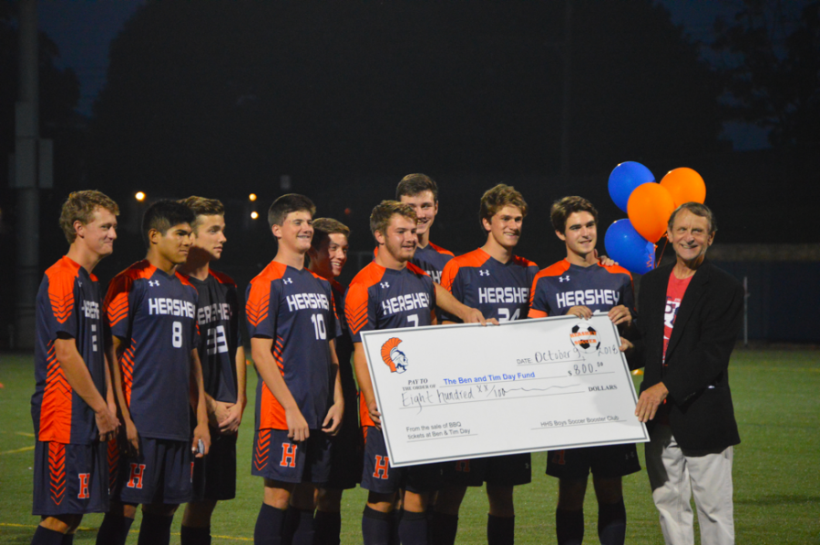 The HHS Boys Soccer Seniors present a check to the Ben and Tim Day Fund. The soccer team raised $800 by selling BBQ tickets and donated the proceeds to the charity. (Broadcaster/Emma Quillen)