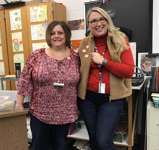 HHS Spanish teacher Mrs. Clouser and Mrs.Ives support the third day of SADD’s Red Ribbon Week. The HHS teachers wore red to show their resistance against drugs. (Broadcaster/Tori Moss)