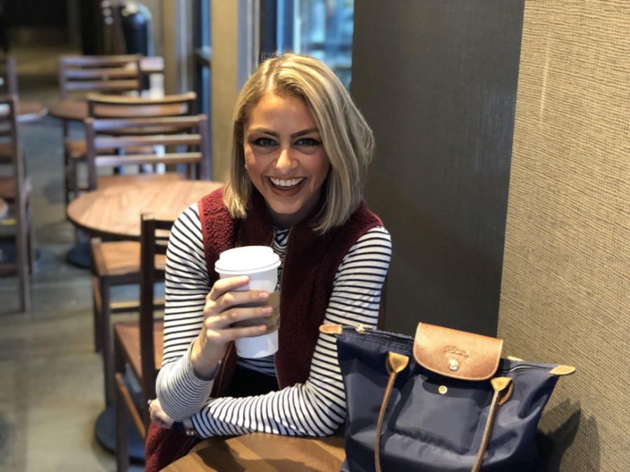 Blogger Lauren Gray poses for a photo while drinking a pumpkin spice latte in Starbucks. Gray likes going to Starbucks to write blog posts because she feels it helps get the creative juices flowing. (Broadcaster/Ashlyn Weidman)