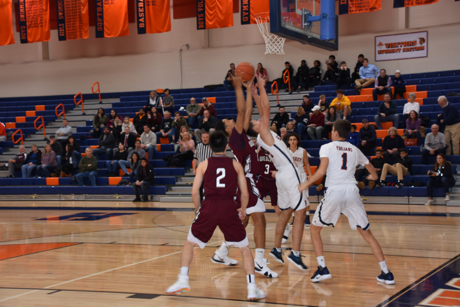 HHS senior Ben Hand shoots the ball into the net. The Trojans play again at home on Friday, December 14, 2018. (Broadcaster/Kate Clark)