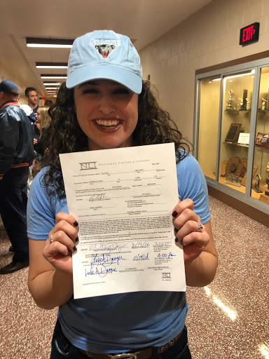 Mallory Drayer poses with the commitment paper she signed to play field hockey at the University of Maine. Drayer signed on November 14, 2018. (Submitted/Mallory Drayer)