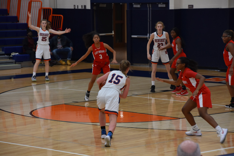 HHS senior captain, Kate Sinz, defends the ball from her opponent. The Trojans were defeated by the Indians with a final score of 43-49. (Broadcaster/Kate Clark)