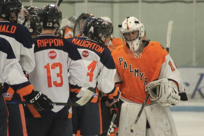 Trojans players shake hands with The Cougars goalie after the game. The Trojans will take the ice again Monday, February 25 at Klick Lewis fighting for a spot in the Bears Cup. (Submitted by Jason Rippon)

