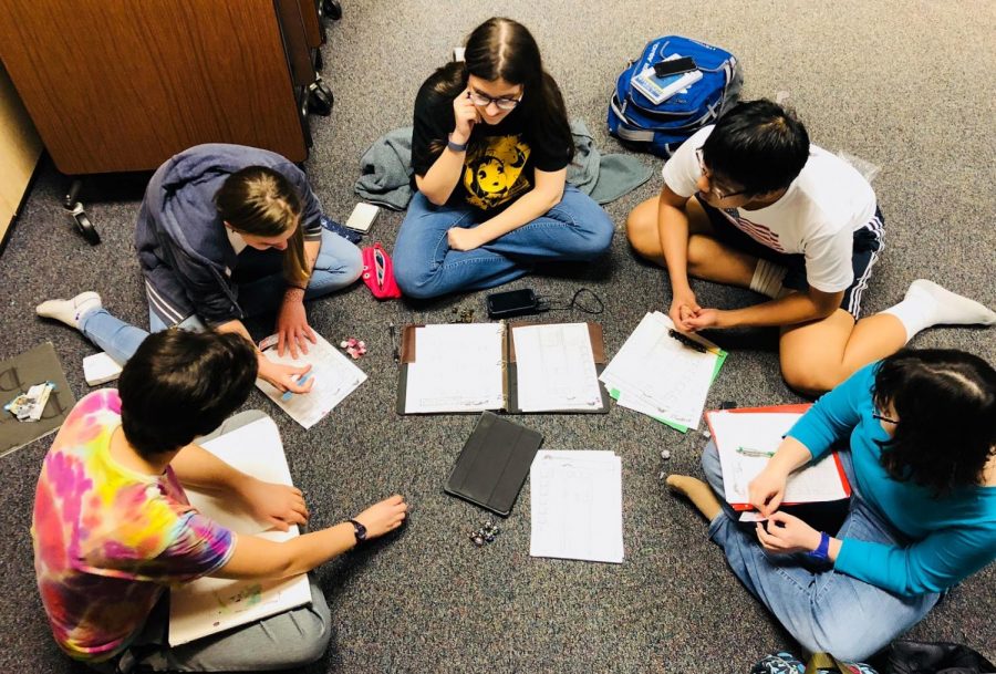 Clockwise from left to right, Zoe Waschbusch, Megan Mehaffie, Diana Cozzi, Luke Wang, and Katherine Tootchen prepare to start a session of Dungeons and Dragons on April 26th, 2019. The group was investigating a mysterious slime in an adventure written by Waschbusch, who acted as the Dungeon Master. (Broadcaster/Lisa Wang)
