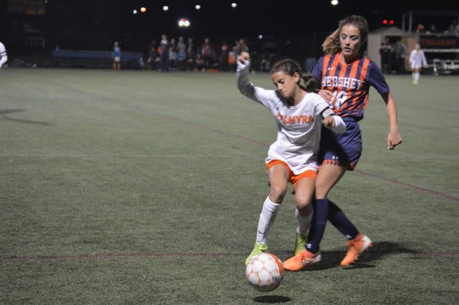 Senior Abby Wilson pressures Palmyra’s captain for the ball on Tuesday, Oct. 8. The game resulted in a double overtime with a final score of 0-0. (Broadcaster/Katie Jones)
