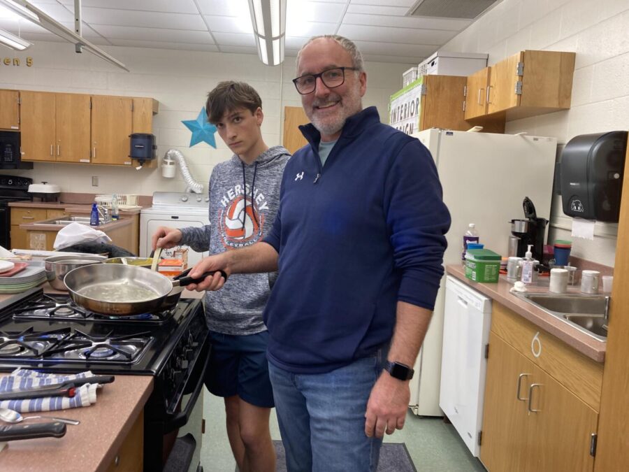 HHS teacher Jeff Mummert shows a Culinary Arts class how to make masala chicken on October 21st. Family Consumer Science teacher Amy Koring has been inviting teachers to come into her classroom to make special dishes. (The Broadcaster/Kamalini Nagarajan)
