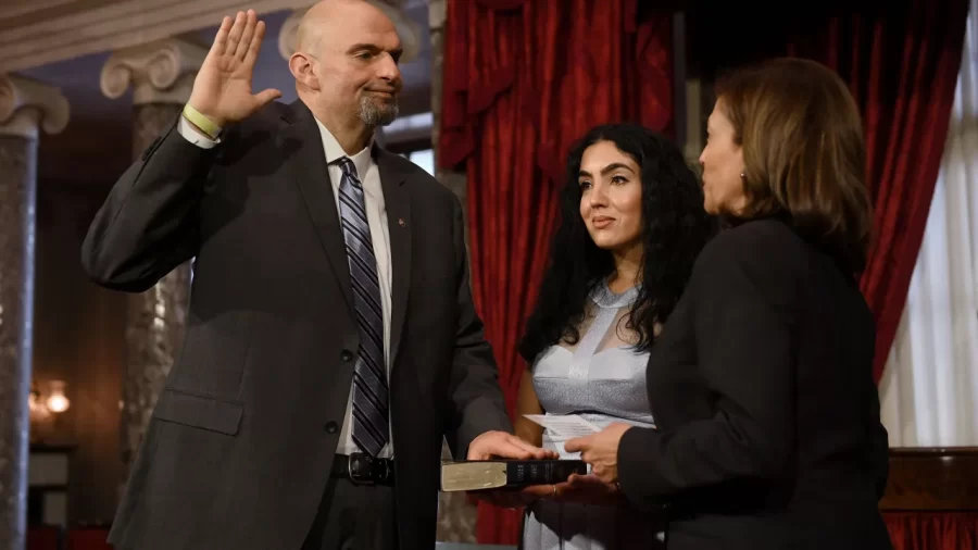 US Vice President Kamala Harris ceremonially swears in US Senator John Fetterman, Democrat of Pennsylvania, for the 118th Congress in the Old Senate Chamber at the US Capitol in Washington, DC, January 3, 2023. – At center is Fetterman’s wife Gisele Barreto Fetterman. (Photo by OLIVIER DOULIERY / AFP) (Photo by OLIVIER DOULIERY/AFP via Getty Images)