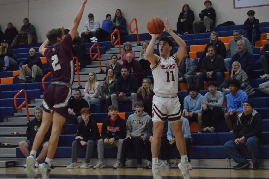 Matthew+DeDonatis+attempts+a+3-pointer+in+front+of+the+Mechanicsburg+student+section.+DeDonatis+led+Hershey+with+24+points+in+the+loss+to+the+Wildcats.+%28Broadcaster%2FJoey+Owsley%29