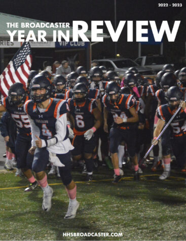 screenshot of the front cover of The Broadcaster Year in Review Newsletter featuring the football team rushing onto the field as a group
